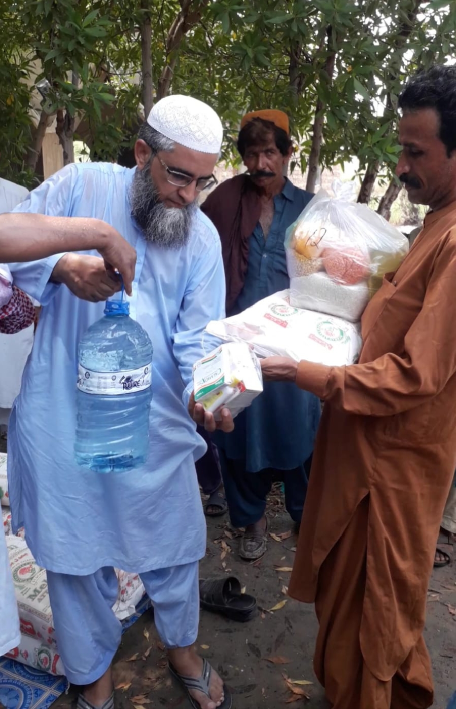 Ration packages and water bottles distribution by Chairman Annaas Welfare Trust